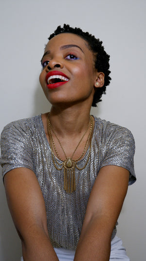 Glenna Sandy, Celebrity Natural Hair Stylist, Toronto. Here she wearing a Bantu Knot Out, one of her favourite looks! She has just under 20yrs experience as a Natural Hair Stylist. Her focus has always been on hair health over length. 